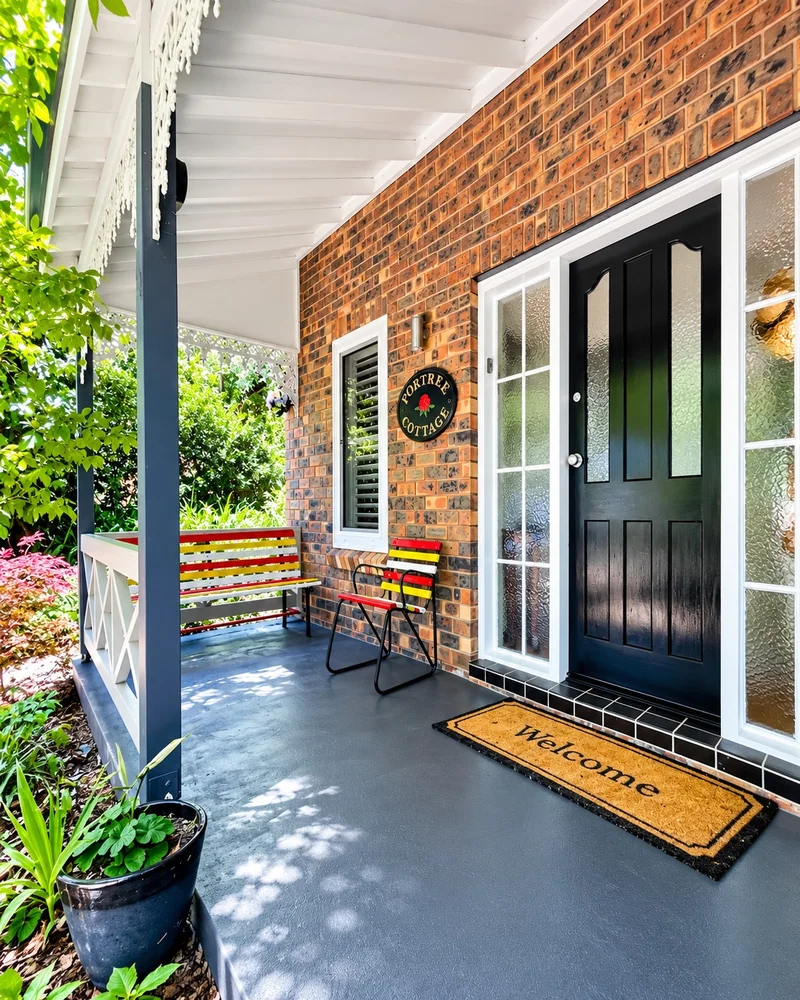 A welcoming spot to sit on the cottage’s front verandah