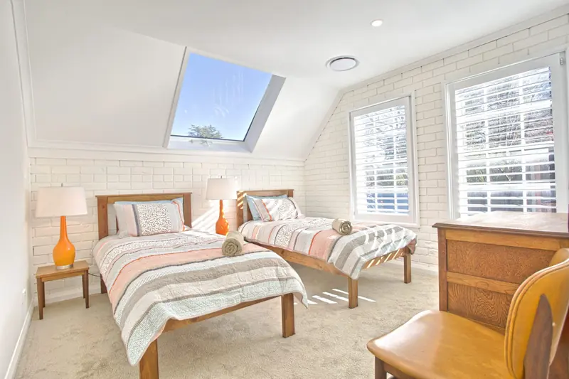 Twin single bedroom beneath the skylight
